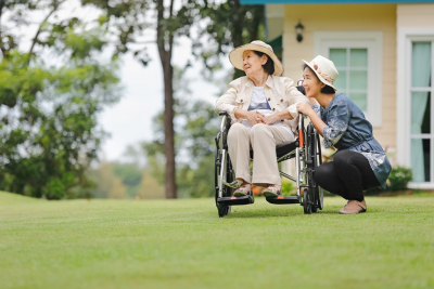 senior woman and caregiver outside