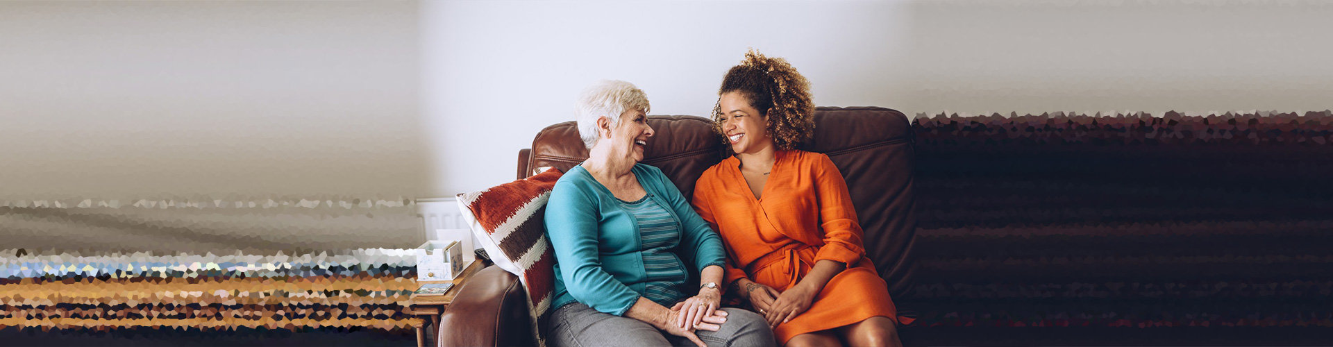 senior and caretaker smiling