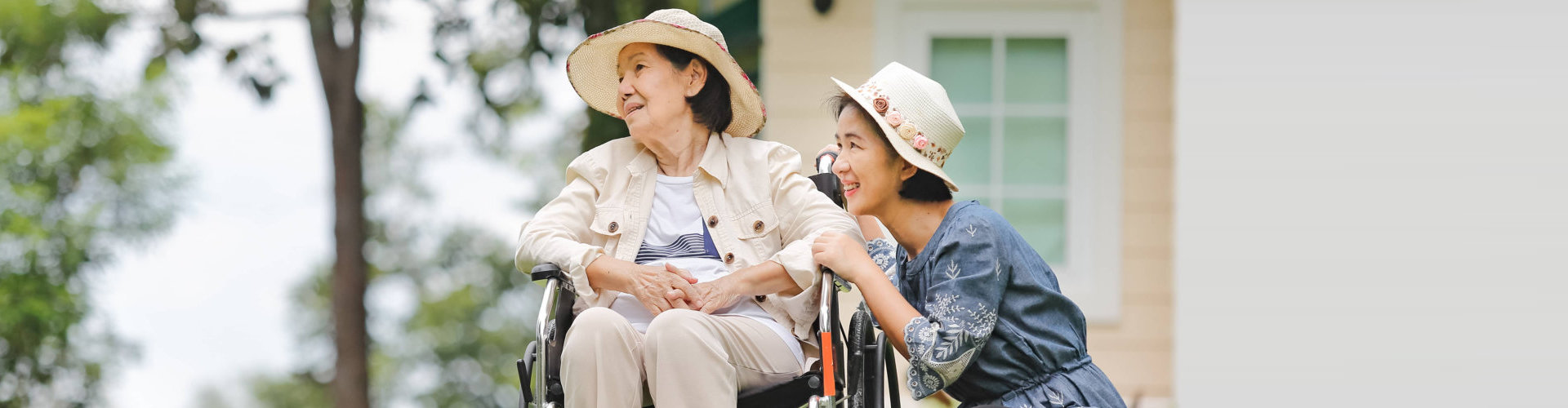 senior woman and caregiver outside